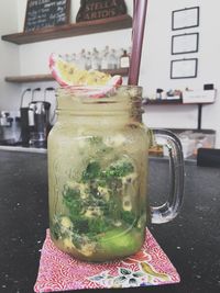 Close-up of drink in glass jar on table