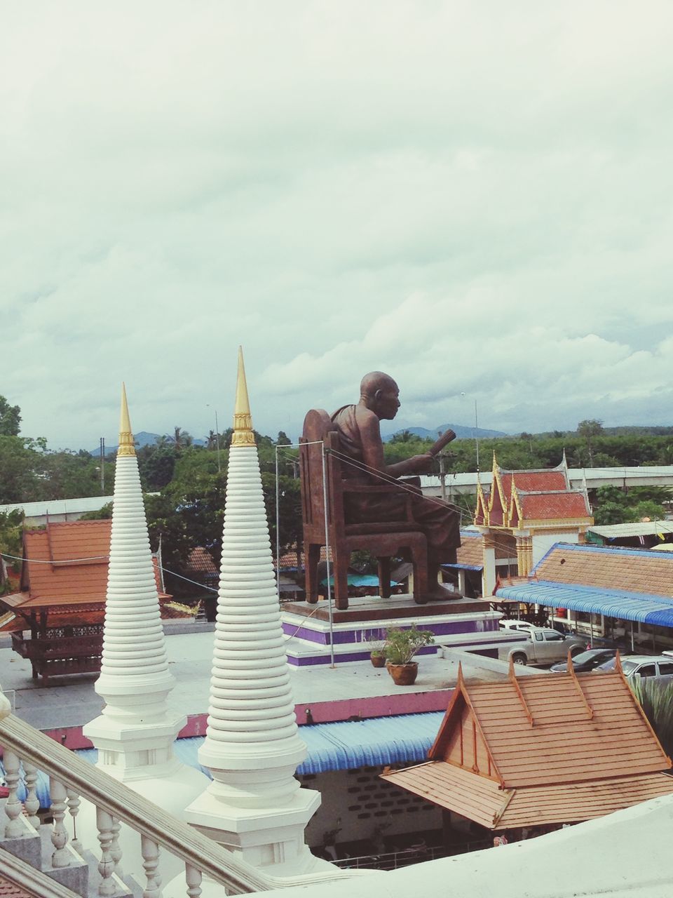 architecture, building exterior, built structure, roof, sky, place of worship, cloud - sky, religion, spirituality, temple - building, low angle view, cloudy, cloud, roof tile, day, outdoors, travel destinations, no people, house