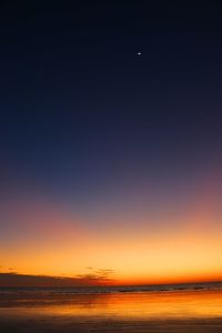 Scenic view of sea against sky at sunset