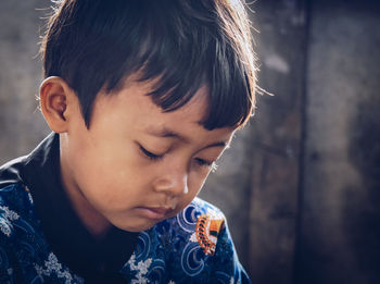 Close-up of boy looking away