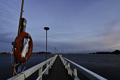 Pier over sea against sky