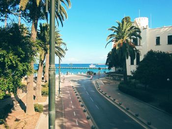 Street by sea against sky