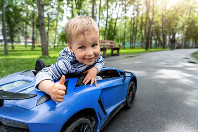 Portrait of boy in car