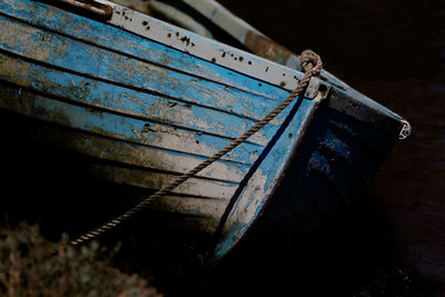 Close-up of boat moored in water