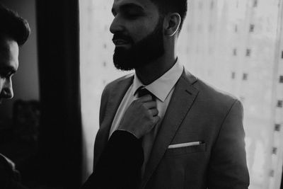 Portrait of young man looking at camera