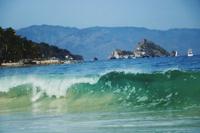 Scenic view of sea against clear blue sky