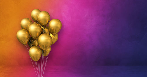 Heart shaped balloons against colored background