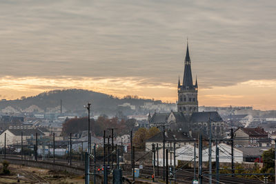 Panoramic view of buildings in city against sky during sunset