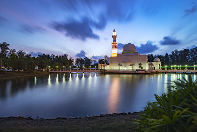 Panoramic view of lake and buildings against sky