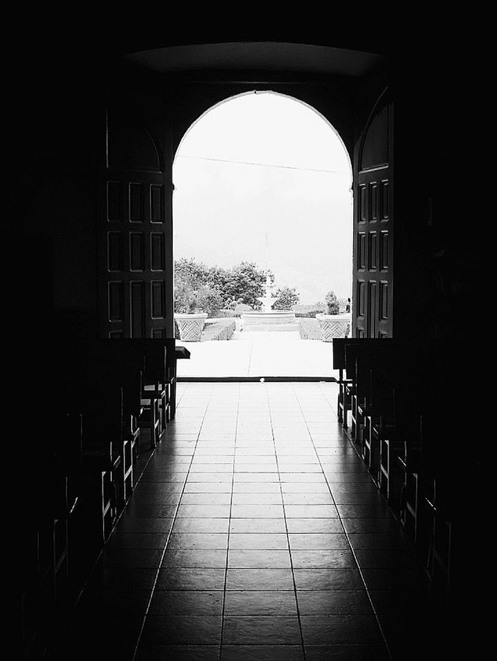 architecture, built structure, arch, indoors, building exterior, the way forward, railing, archway, day, entrance, window, tree, empty, building, gate, no people, walkway, leading, door, sky