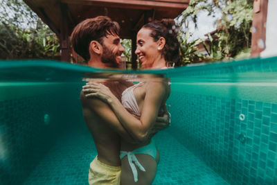 Young couple in swimming pool