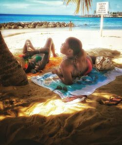 High angle view of people on sandy beach