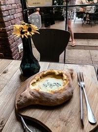 Flower vase on table in restaurant