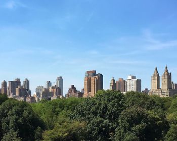 High angle view of cityscape against blue sky