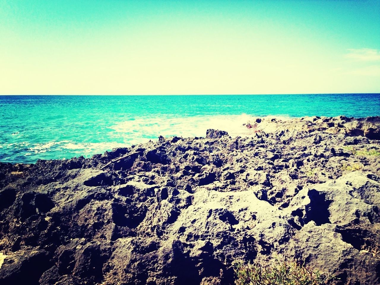 sea, horizon over water, water, blue, tranquil scene, scenics, tranquility, beauty in nature, beach, clear sky, nature, copy space, shore, sky, idyllic, seascape, coastline, outdoors, day, rock - object