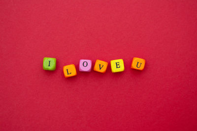 Close-up of text written on red table