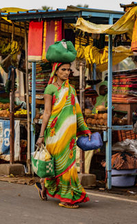 Full length of woman standing at market