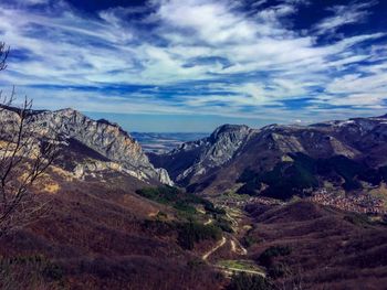 Scenic view of landscape and mountains against sky