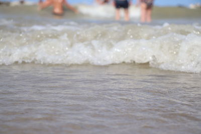 Low section of people on beach