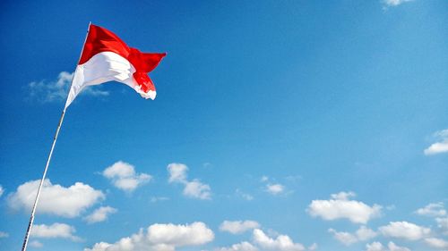 Low angle view of flag against sky