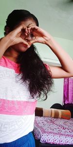 Portrait of woman wearing hat at home