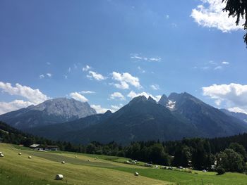 Scenic view of landscape and mountains against sky