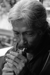 Close-up of man smoking cigarette