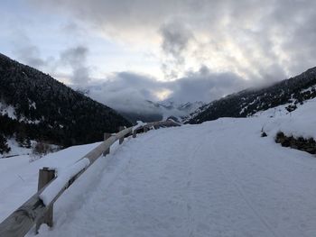 Scenic view of snow covered mountains against sky