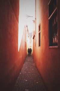 Narrow alley along buildings