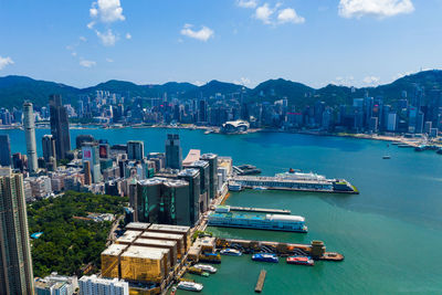 High angle view of bay and buildings against sky