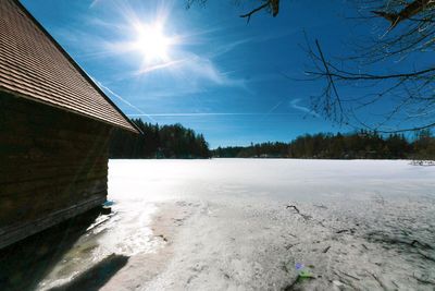 Scenic view of landscape against blue sky on sunny day