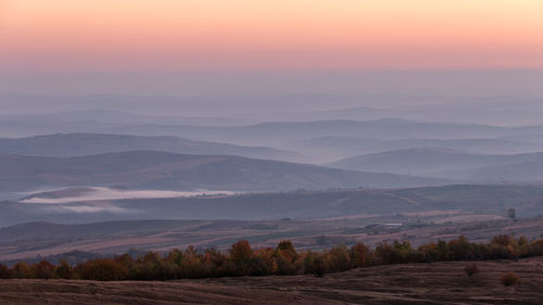 Scenic view of landscape against sky during sunset