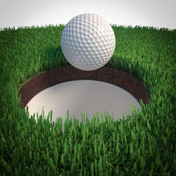 Close-up of golf ball on field