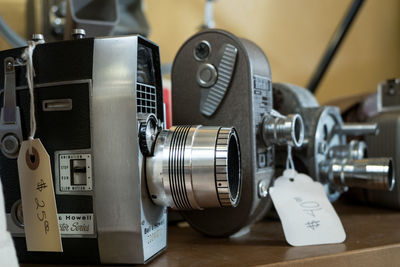 Close-up of vintage cameras at store for sale