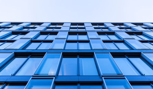 Low angle view of modern building against clear sky