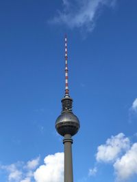 Low angle view of communications tower against sky