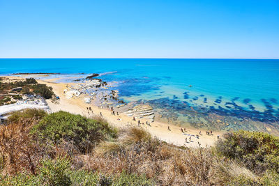 Scenic view of sea against clear blue sky