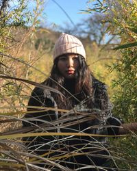 Portrait of young woman in forest