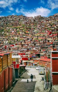 Buildings against cloudy sky