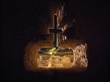 Close-up of illuminated lamp at night