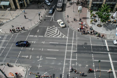 High angle view of people walking on road