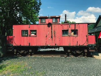 Train on railroad track against sky