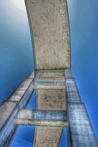 Low angle view of bridge against blue sky