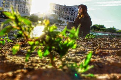 Woman with plants in foreground