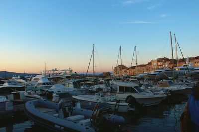 Boats moored at harbor