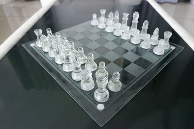 High angle view of chess pieces on table