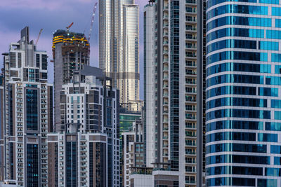 Low angle view of buildings in city against sky