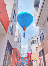 Low angle view of multi colored buildings against sky