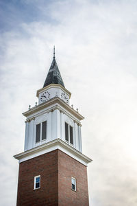 Low angle view of clock tower against sky