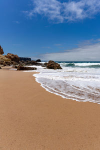 Scenic view of beach against sky